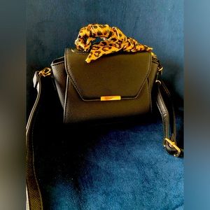 Small black top-handle crossbody bag